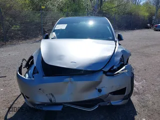 2024 Tesla Model Y Long Range with VIN 7SAYGDEE2RA311261, listed as a IAAI auction lot 41534010 with Not Provided miles and . Bid and sale history available at DreamBid. Image 13.