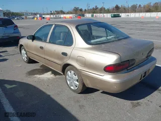 1997 Geo Prizm with VIN 1Y1SK5265VZ460271, listed as a IAAI auction lot 41185903 with 234,015 mi miles. Bid and sale history available at carsss.com. Image 3.