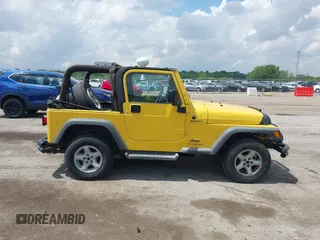 2004 Jeep Wrangler Sport z VIN 1J4FA49S04P701986, wystawiony jako IAAI lot #42256648 z przebiegiem 129 946 mil mil oraz . Historia ofert i sprzedaży dostępna na DreamBid. Obrazek 13.