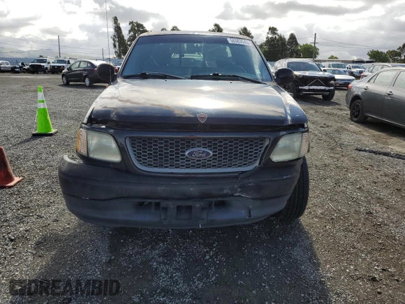 2001 Ford F-150 XL with VIN 1FTRX17W91NB71630, listed as a Copart auction lot 56583545 with 209,009 mi miles and Salvage title. Bid and sale history available at DreamBid. Image 5.