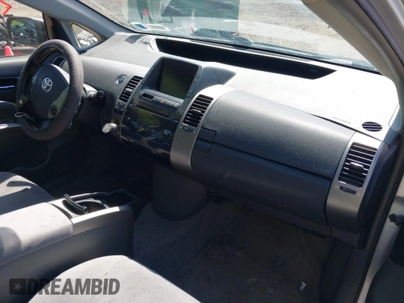 2006 Toyota Prius z VIN JTDKB20U667543175, wystawiony jako IAAI lot #42313159 z przebiegiem 277 637 mil mil oraz . Historia ofert i sprzedaży dostępna na DreamBid. Obrazek 5.