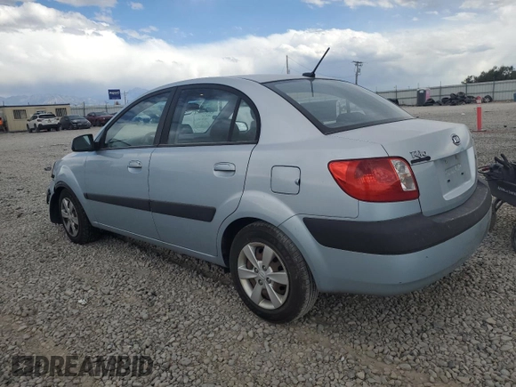 2009 Kia Rio LX with VIN KNADE223496469797, listed as a Copart auction lot 71005774 with 130,675 mi miles and Salvage Title. Bid and sale history available at DreamBid. Image 2.