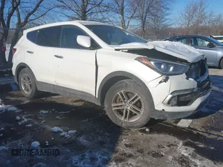 2018 Hyundai Santa Fe 2.4L z VIN 5NMZTDLB3JH090782, wystawiony jako IAAI lot #41394771 z przebiegiem 125 490 mil mil oraz . Historia ofert i sprzedaży dostępna na DreamBid. Obrazek 1.