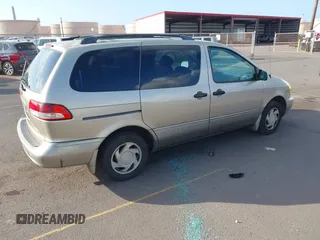 2002 Toyota Sienna LE with VIN 4T3ZF13C82U457803, listed as a IAAI auction lot 41198246 with 185,445 mi miles and . Bid and sale history available at DreamBid. Image 4.