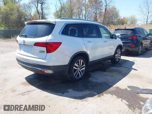 2016 Honda Pilot Touring with VIN 5FNYF6H9XGB005516, listed as a IAAI auction lot 41975049 with 85,217 mi miles. Bid and sale history available at carsss.com. Image 4.