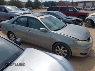 2005 Toyota Camry LE with VIN 4T1BF30K75U618325, listed as a IAAI auction lot 42152020 with 245,183 mi miles and . Bid and sale history available at DreamBid. Image 1.