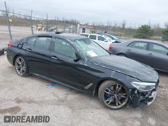 2018 BMW 5 Series M550i xDrive with VIN WBAJB9C56JB286742, listed as a IAAI auction lot 42176643 with 61,445 mi miles and . Bid and sale history available at DreamBid. Image 1.