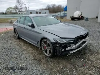 2023 BMW 5 Series M550i xDrive with VIN WBA13BK06PCN02733, listed as a Copart auction lot 48767235 with 27,725 mi miles and Salvage title. Bid and sale history available at DreamBid. Image 13.
