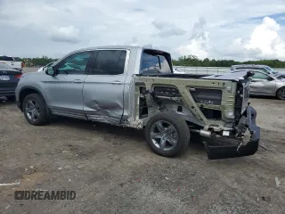 2023 Honda Ridgeline RTL-E with VIN 5FPYK3F70PB018858, listed as a Copart auction lot 64210205 with 16,562 mi miles and Salvage title. Bid and sale history available at DreamBid. Image 2.