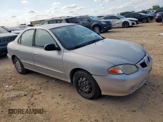1999 Hyundai Elantra z VIN KMHJF25F1XU777099, wystawiony jako Copart lot #58870035 z przebiegiem 69 470 mil mil oraz Czysty tytuł • Clean title. Historia ofert i sprzedaży dostępna na DreamBid. Obrazek 4.