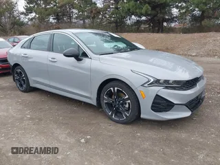 2024 Kia K5 GT-Line z VIN 5XXG64J23RG253362, wystawiony jako IAAI lot #41848600 z przebiegiem 17 481 mil mil oraz . Historia ofert i sprzedaży dostępna na DreamBid. Obrazek 1.