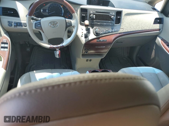 2014 Toyota Sienna XLE with VIN 5TDYK3DC8ES414814, listed as a Copart auction lot 64577875 with 111,675 mi miles and Salvage title. Bid and sale history available at DreamBid. Image 8.