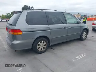 2002 Honda Odyssey EX-L z VIN 2HKRL18922H542116, wystawiony jako IAAI lot #42130335 z przebiegiem 205 053 mil mil oraz . Historia ofert i sprzedaży dostępna na DreamBid. Obrazek 4.