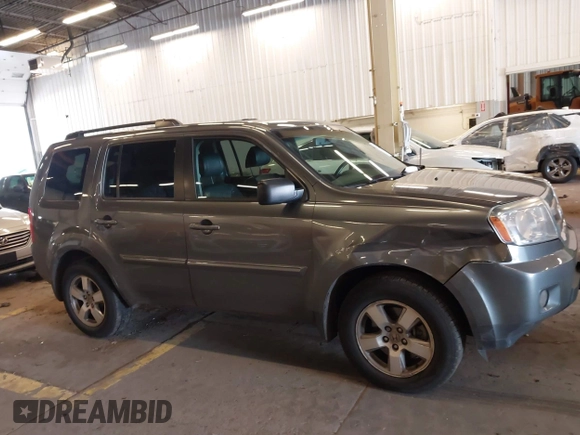 2011 Honda Pilot EX-L with VIN 5FNYF4H65BB020721, listed as a IAAI auction lot 41794436 with 113,630 mi miles and . Bid and sale history available at carsss.com. Image 13.