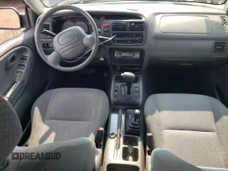 2001 Chevrolet Tracker z VIN 2CNBJ13C616955326, wystawiony jako Copart lot #64105184 z przebiegiem 138 156 mil mil oraz Tytuł czysty. Historia ofert i sprzedaży dostępna na DreamBid. Obrazek 8.
