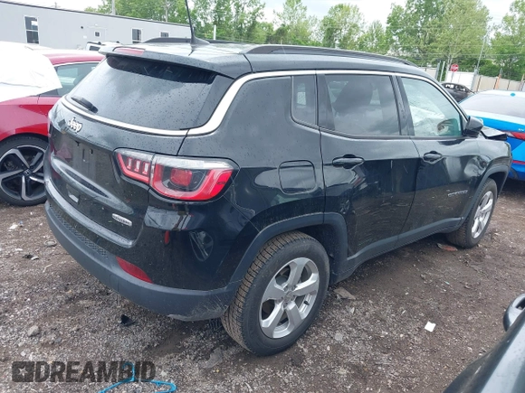 2017 Jeep Compass Latitude with VIN 3C4NJCBB3HT653021, listed as a IAAI auction lot 42263281 with 91,076 mi miles and . Bid and sale history available at DreamBid. Image 4.