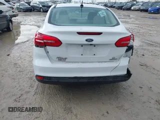 2016 Ford Focus SE z VIN 1FADP3F23GL343651, wystawiony jako IAAI lot #41668112 z przebiegiem 120 891 mil mil oraz . Historia ofert i sprzedaży dostępna na DreamBid. Obrazek 6.