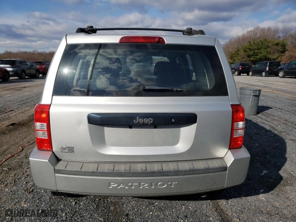 2010 Jeep Patriot Sport with VIN 1J4NT2GA9AD506311, listed as a Copart auction lot 83174964 with 231,694 mi miles and Clean Title. Bid and sale history available at carsss.com. Image 6.