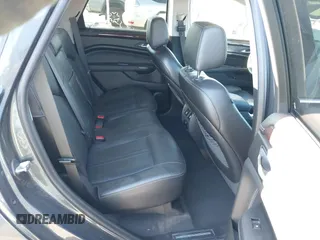 2013 Cadillac SRX Premium Collection z VIN 3GYFNEE37DS525612, wystawiony jako IAAI lot #41344221 z przebiegiem 119 573 mil mil oraz . Historia ofert i sprzedaży dostępna na DreamBid. Obrazek 8.