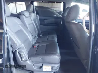 2014 Honda Odyssey Touring with VIN 5FNRL5H94EB110590, listed as a IAAI auction lot 42092929 with 242,338 mi miles and . Bid and sale history available at DreamBid. Image 8.