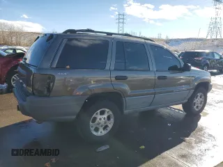 1999 Jeep Grand Cherokee Laredo with VIN 1J4GW58N9XC633464, listed as a Copart auction lot 84682454 with 212,738 mi miles and Salvage title. Bid and sale history available at DreamBid. Image 3.