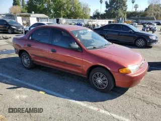 1998 Mazda Protege DX z VIN JM1BC1411W0198007, wystawiony jako Copart lot #46941185 z przebiegiem 101 696 mil mil oraz Szkoda całkowita • Salvage title. Historia ofert i sprzedaży dostępna na DreamBid. Obrazek 4.