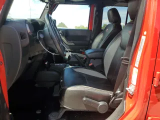 2018 Jeep Wrangler JK Unlimited Sport S with VIN 1C4HJWDG4JL898662, listed as a Copart auction lot 69213864 with 52,773 mi miles and Salvage Title. Bid and sale history available at carsss.com. Image 7.