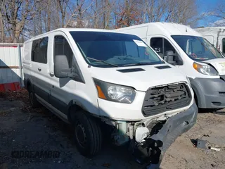 2017 Ford Transit with VIN 1FTYR1ZG3HKA51703, listed as a IAAI auction lot 41246407 with 183,118 mi miles. Bid and sale history available at carsss.com. Image 1.