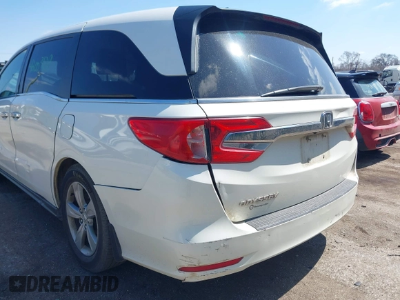 2018 Honda Odyssey EX-L z VIN 5FNRL6H70JB102713, wystawiony jako IAAI lot #42003129 z przebiegiem 410 500 mil mil oraz . Historia ofert i sprzedaży dostępna na DreamBid. Obrazek 6.
