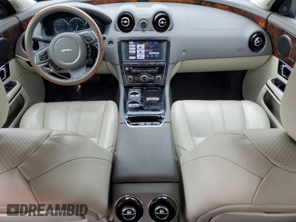 2014 Jaguar XJ z VIN SAJWJ1CD9E8V62338, wystawiony jako Copart lot #58924065 z przebiegiem 60 909 mil mil oraz Czysty tytuł • Clean title. Historia ofert i sprzedaży dostępna na DreamBid. Obrazek 8.