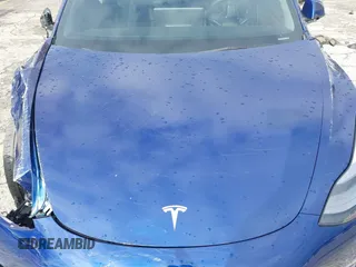 2023 Tesla Model 3 with VIN 5YJ3E1EA0PF518983, listed as a IAAI auction lot 41749225 with 26,748 mi miles and . Bid and sale history available at DreamBid. Image 10.