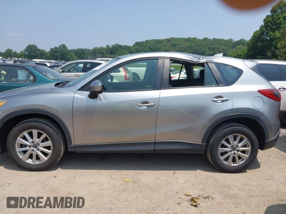 2014 Mazda CX-5 Sport with VIN JM3KE4BE9E0411177, listed as a IAAI auction lot 42411938 with 167,709 mi miles and . Bid and sale history available at DreamBid. Image 14.