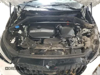 2023 BMW X1 xDrive28i with VIN WBX73EF08P5X60980, listed as a Copart auction lot 59899385 with 21,975 mi miles and Salvage title. Bid and sale history available at DreamBid. Image 12.
