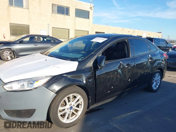 2015 Ford Focus SE with VIN 1FADP3F29FL350473, listed as a IAAI auction lot 41032182 with 102,898 mi miles. Bid and sale history available at carsss.com. Image 6.