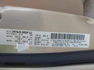 2014 Dodge Grand Caravan SXT with VIN 2C4RDGCG0ER210186, listed as a IAAI auction lot 40813319 with 100,230 mi miles and . Bid and sale history available at DreamBid. Image 9.