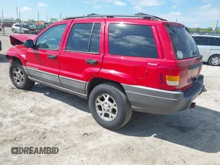 1999 Jeep Grand Cherokee Laredo with VIN 1J4GW58S7XC746609, listed as a IAAI auction lot 42260018 with 254,352 mi miles and . Bid and sale history available at DreamBid. Image 3.