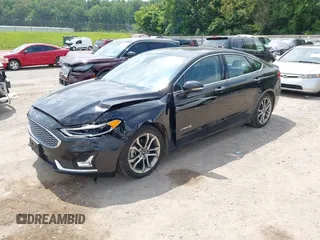 2019 Ford Fusion Titanium z VIN 3FA6P0RU0KR260239, wystawiony jako IAAI lot #42436643 z przebiegiem 114 631 mil mil oraz . Historia ofert i sprzedaży dostępna na DreamBid. Obrazek 2.