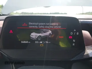 2022 Volkswagen ID.4 Pro S z VIN WVGGNPE24NP059968, wystawiony jako IAAI lot #42210089 z przebiegiem 36 860 mil mil oraz . Historia ofert i sprzedaży dostępna na DreamBid. Obrazek 7.