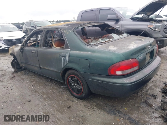 1999 Mazda 626 ES z VIN 1YVGF22C1X5840702, wystawiony jako IAAI lot #41047339 z przebiegiem Nie podano mil oraz . Historia ofert i sprzedaży dostępna na DreamBid. Obrazek 3.