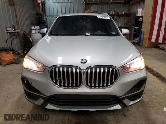 2021 BMW X1 xDrive28i with VIN WBXJG9C01M5T49891, listed as a Copart auction lot 51126685 with 93,696 mi miles and Clean Title. Bid and sale history available at carsss.com. Image 5.