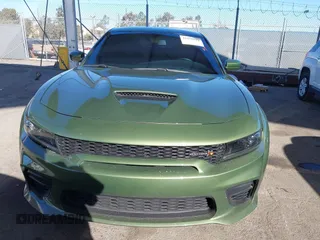 2022 Dodge Charger Scat Pack Widebody with VIN 2C3CDXGJ1NH216763, listed as a IAAI auction lot 41259159 with 32,610 mi miles and . Bid and sale history available at DreamBid. Image 12.