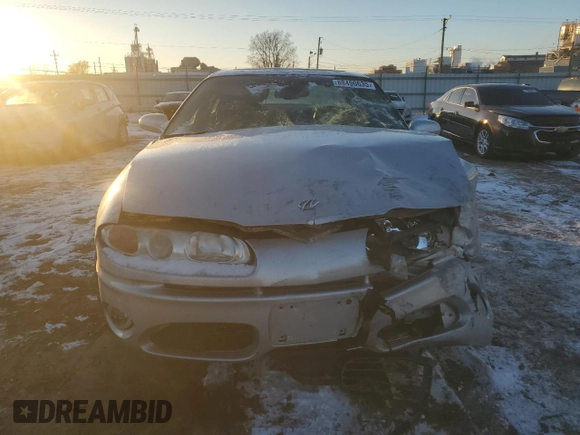 2003 Oldsmobile Aurora z VIN 1G3GS64C034150414, wystawiony jako Copart lot #88490635 z przebiegiem 119 061 mil mil oraz Szkody całkowita. Historia ofert i sprzedaży dostępna na DreamBid. Obrazek 5.