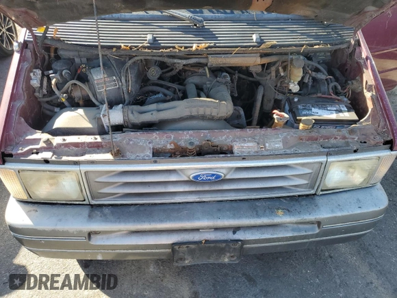 1994 Ford Aerostar z VIN 1FMCA11U3RZA85857, wystawiony jako Copart lot #79948454 z przebiegiem 211 748 mil mil oraz Tytuł czysty. Historia ofert i sprzedaży dostępna na DreamBid. Obrazek 12.