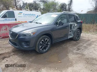 2016 Mazda CX-5 Grand Touring with VIN JM3KE4DYXG0830150, listed as a IAAI auction lot 41961007 with 142,570 mi miles and . Bid and sale history available at DreamBid. Image 19.
