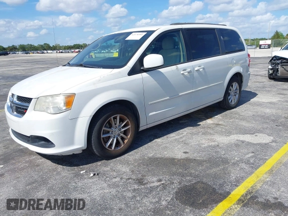 2014 Dodge Grand Caravan SXT with VIN 2C4RDGCGXER322705, listed as a IAAI auction lot 42170301 with 147,070 mi miles and . Bid and sale history available at DreamBid. Image 2.