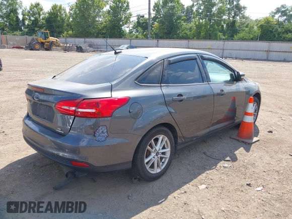 2016 Ford Focus SE with VIN 1FADP3F23GL392347, listed as a IAAI auction lot 39951722 with 143,679 mi miles. Bid and sale history available at carsss.com. Image 4.