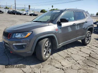 2018 Jeep Compass Trailhawk with VIN 3C4NJDDB0JT130449, listed as a Copart auction lot 57486015 with 87,318 mi miles and Salvage title. Bid and sale history available at DreamBid. Image 1.