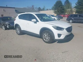 2015 Mazda CX-5 Sport with VIN JM3KE4BY3F0495511, listed as a IAAI auction lot 42170968 with 206,217 mi miles and . Bid and sale history available at carsss.com. Image 1.