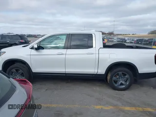 2023 Honda Ridgeline RTL with VIN 5FPYK3F55PB018188, listed as a IAAI auction lot 41952319 with 73,019 mi miles and . Bid and sale history available at DreamBid. Image 14.