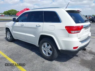 2011 Jeep Grand Cherokee Laredo with VIN 1J4RS4GG0BC573388, listed as a IAAI auction lot 42167064 with 63,363 mi miles and . Bid and sale history available at DreamBid. Image 3.